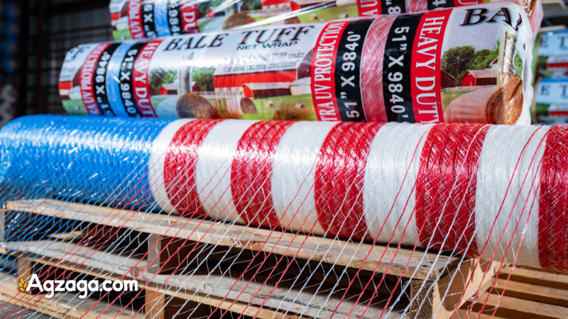 Warehouse pallet loaded with net wrap rolls labeled for delivery 