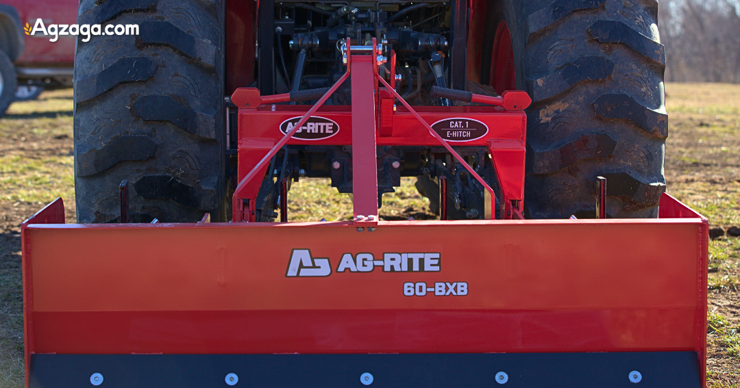 Tractor using box blade to maintain rural gravel driveway