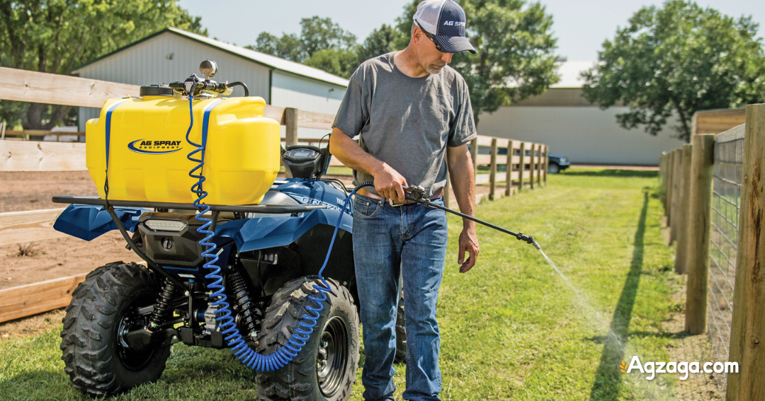 Operator using UTV sprayer to apply herbicide to fence line
